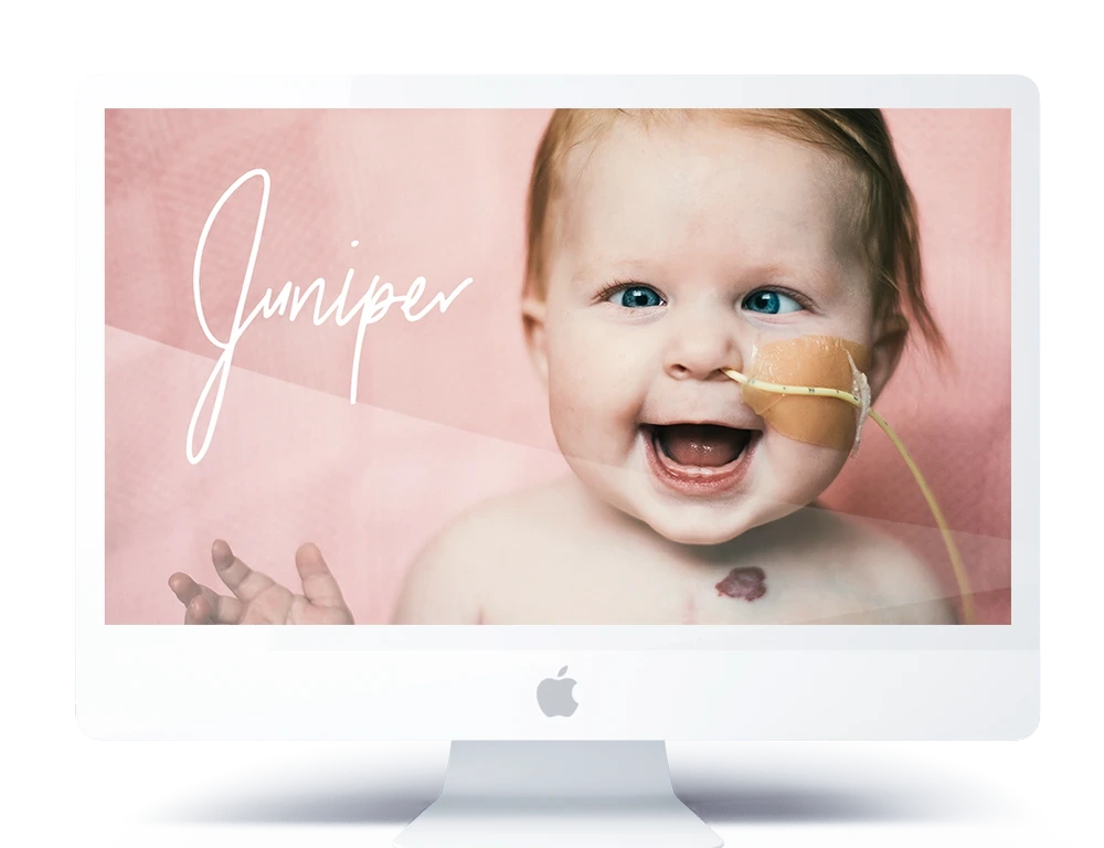 An iMac showing a smiling baby