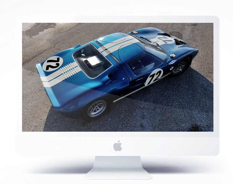 A blue Ford GT40 on an iMac screen
