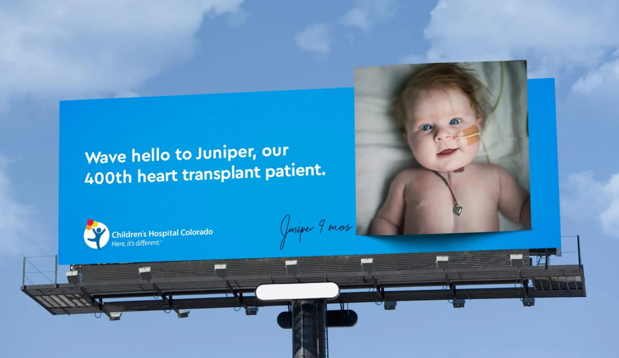 A billboard: Wave hello to Juniper, our 400th heart transplant patient