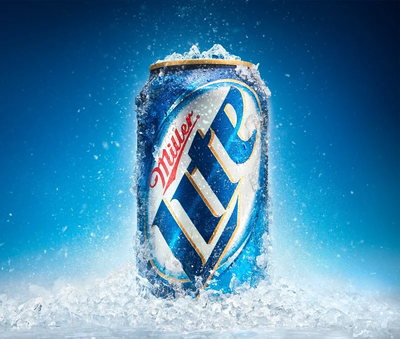 A Miller Lite can in ice on a blue field