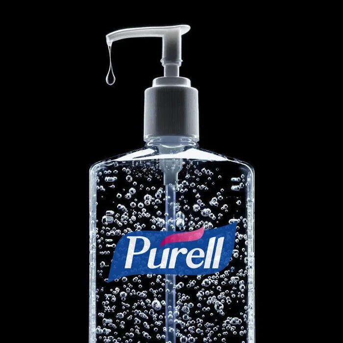 A Purell bottle on black