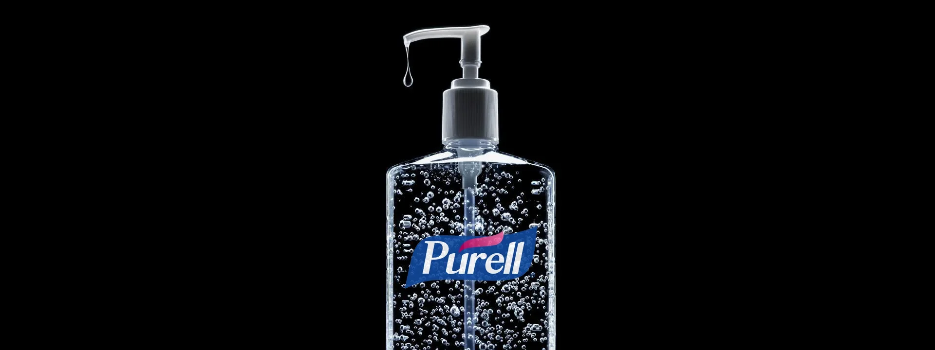 A Purell bottle on black